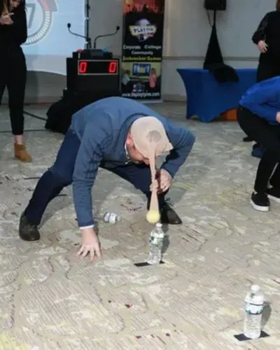 Rutgers freshman plays a hands-on challenge during an orientation game show in NJ